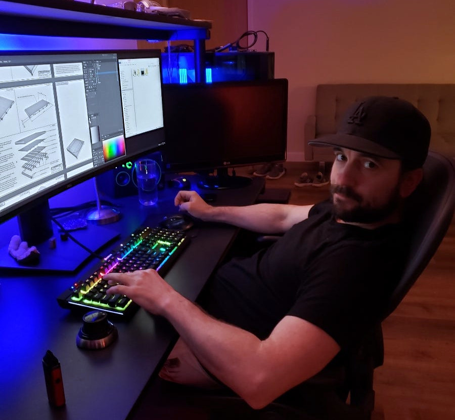 Matt Guertin designing InfiniSet at his multi-monitor CAD workstation, 2021